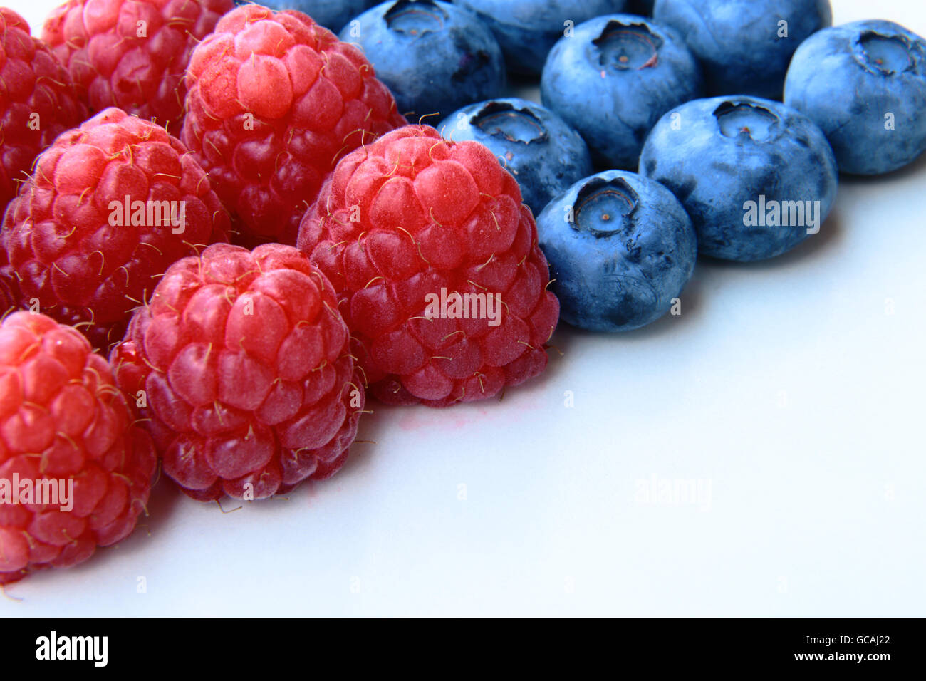 closeup of a bunch of blueberries and raspberries Stock Photo