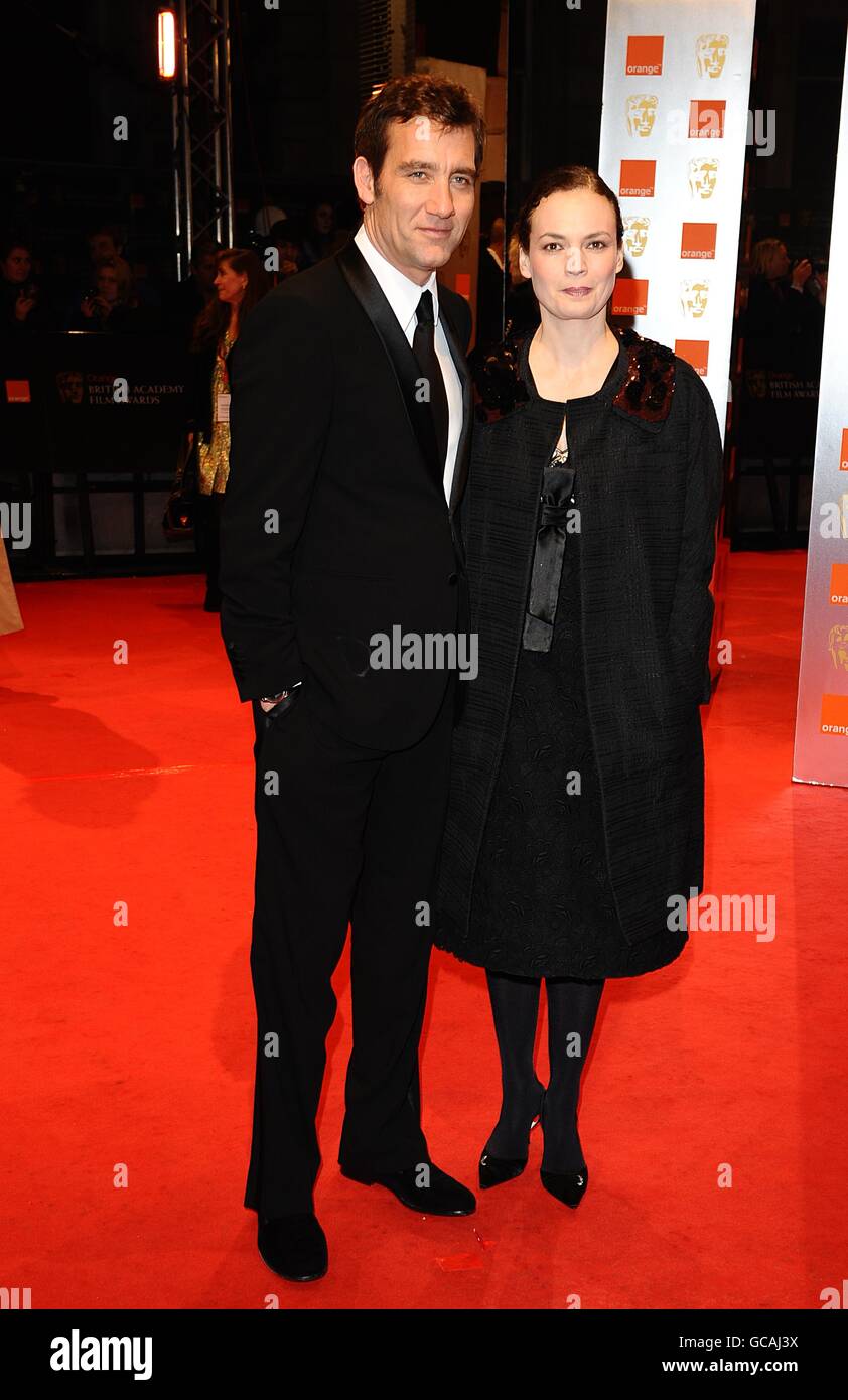 Clive Owen and wife Sarah-Jane arriving for the Orange British Academy Film Awards, at The Royal Opera House, London. Stock Photo