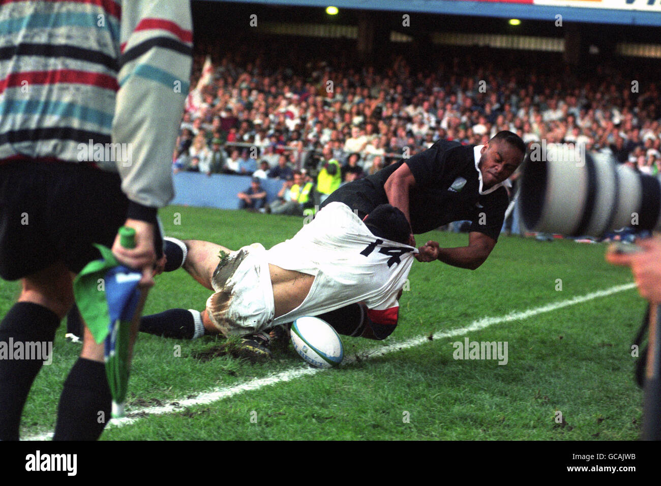 England Winger Tony Underwood Left Feels The Full Force Of A Tackle Stock Photo Alamy