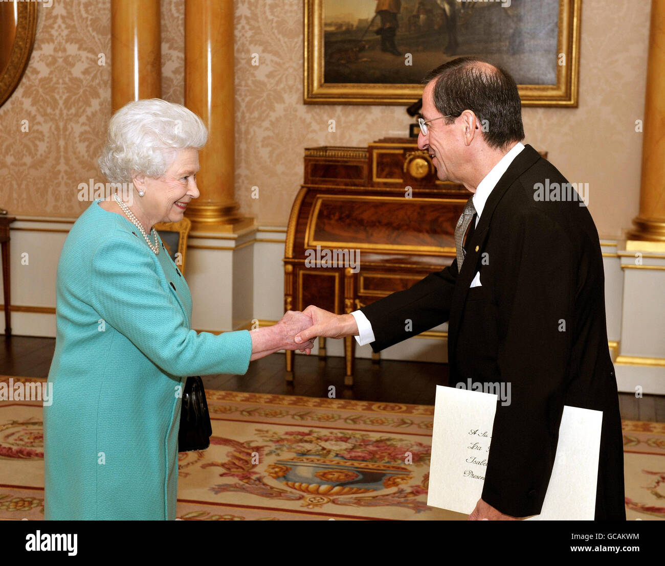 Queen Elizabeth II shakes hands with His Excellency the Ambassador of  Paraguay Mr Miguel Solano-Lopez, before he presented his credentials at a  private audience in Buckingham Palace in central London Stock Photo -