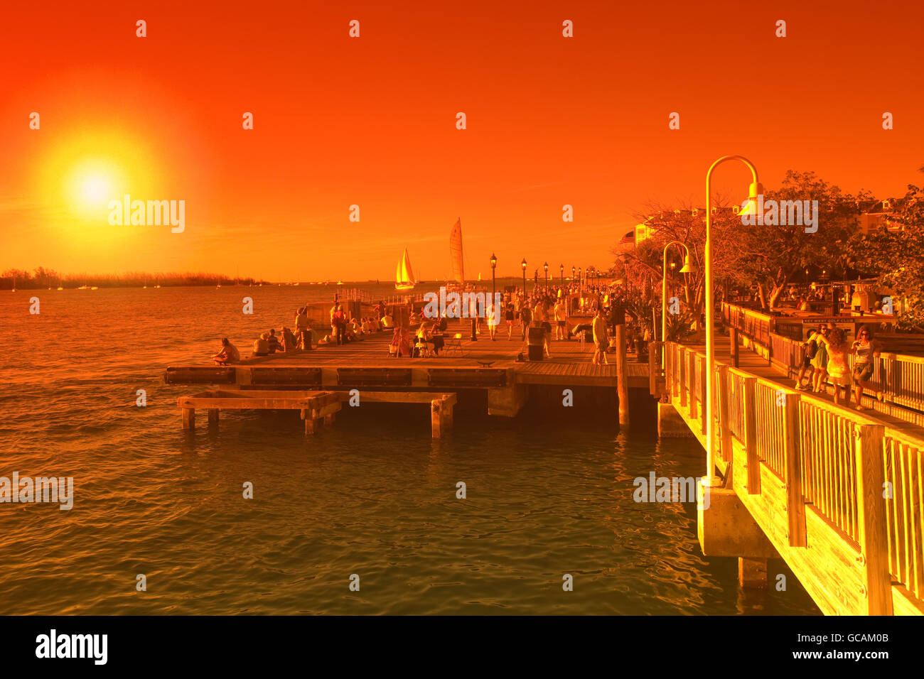 TOURISTS WATCHING SUNSET MALLORY SQUARE OLD TOWN HISTORIC DISTRICT KEY