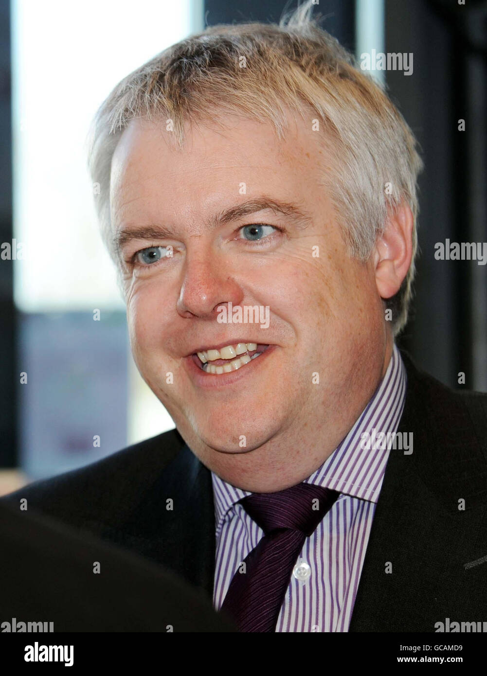 First Minister Carwyn Jones leaves the Canolfan Gorseinon Centre after he launched an attempt to run public services more efficiently and avoid 'crude cuts' today. Stock Photo