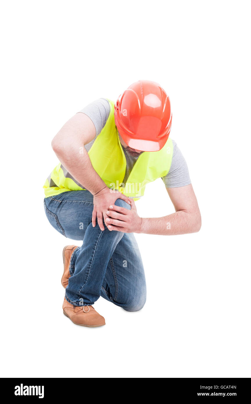 Male constructor kneeling and suffering from knee pain as medical