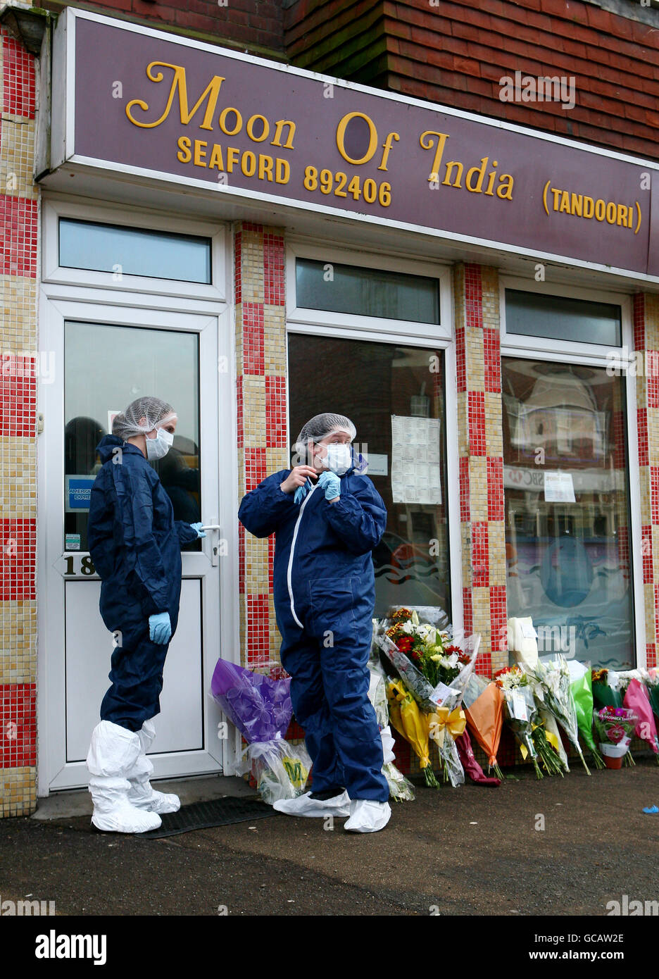 Crime scene investigators continue to investigate the flats above the