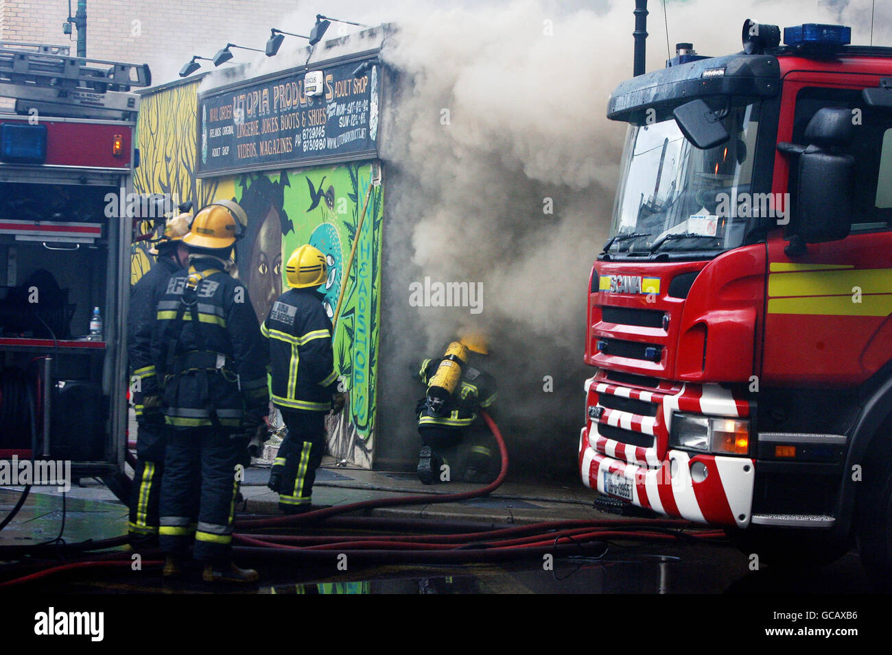 Members of Dublin Fire Brigade tackle a blaze at the Nirvana head shop on Capel Street, Dublin. Stock Photo