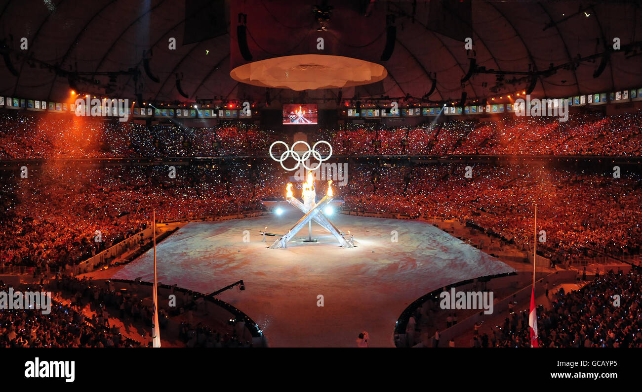 The Olympic torch is lit during the 2010 Winter Olympics Opening Ceremony at BC Place, Vancouver, Canada. Stock Photo