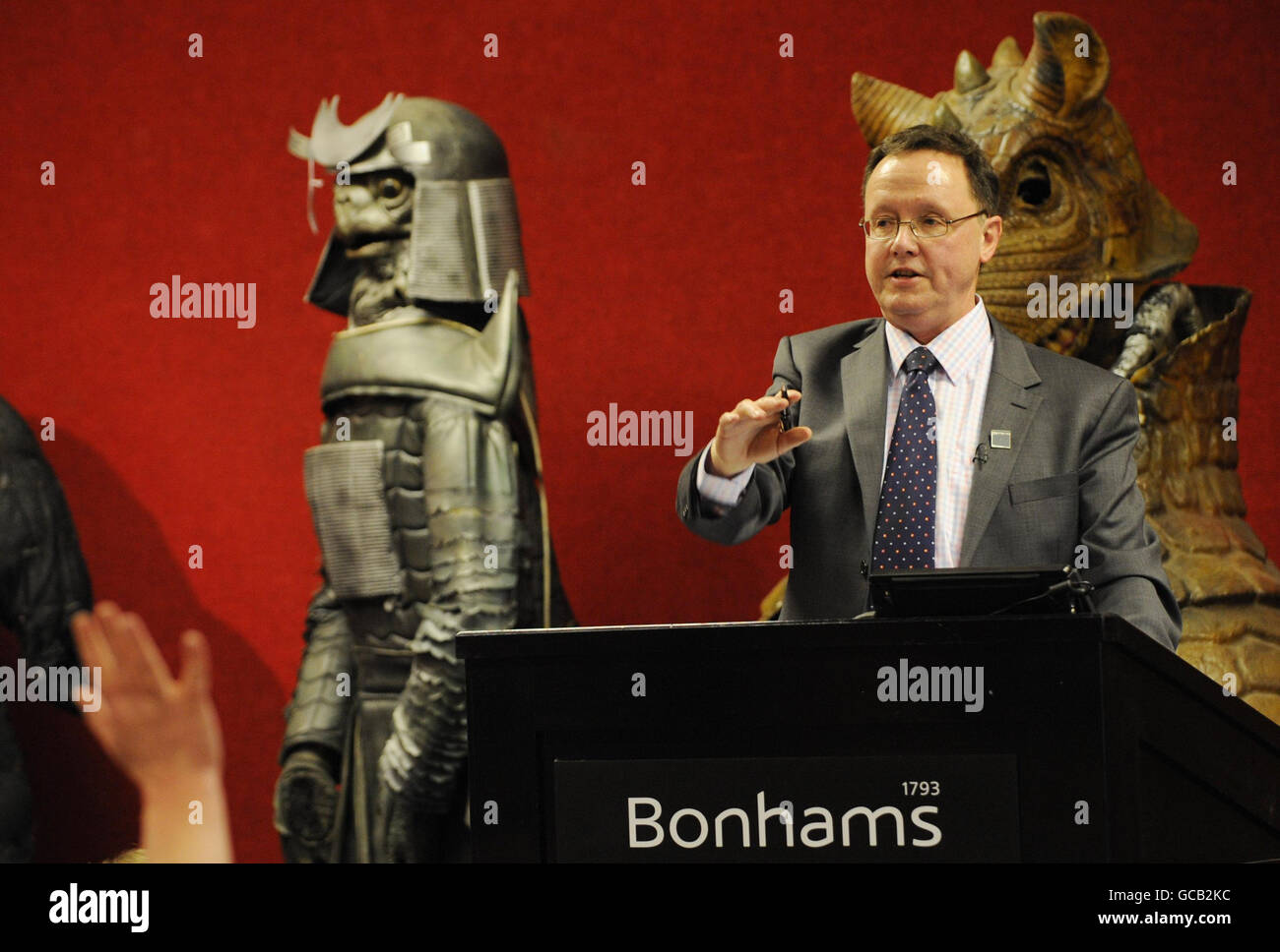 Bonhams auctioneer John Baddeley conducts a sale of props and costumes from the BBC TV series Dr Who in London today. Stock Photo