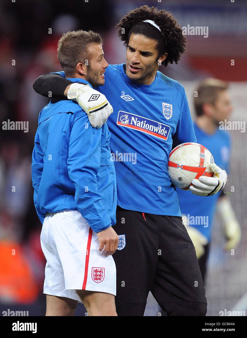 England's David James puts a friendly arm around team mate David Beckham  (left) during their pre-match warm up Stock Photo - Alamy