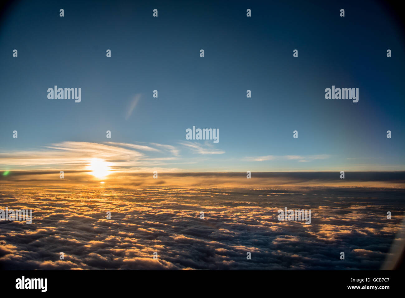sunset seen from airplane, flying above clouds Stock Photo - Alamy