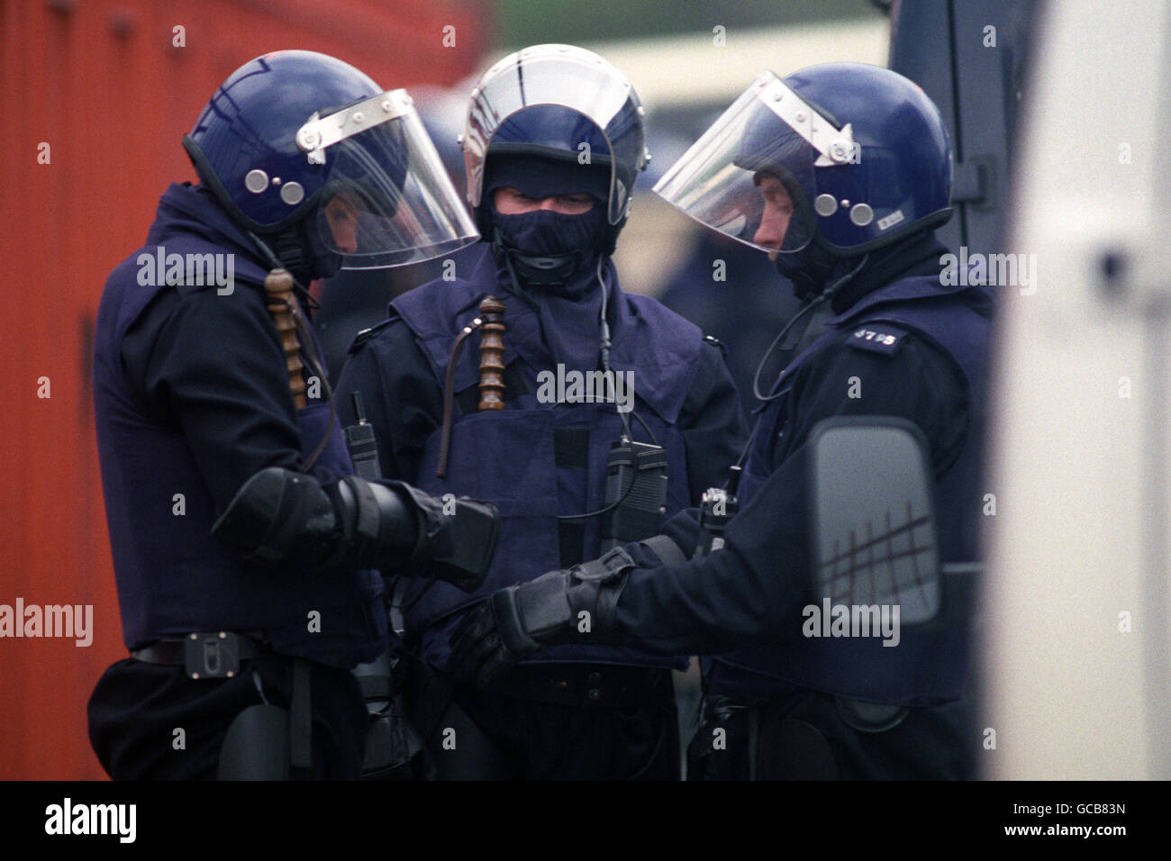Police officers prepare their riot clothing outside the Strangeways Prison in Manchester. Stock Photo
