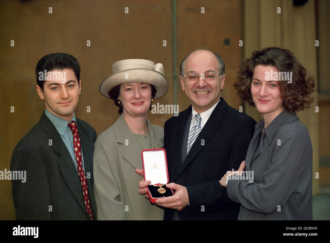 Sir Jeremy Beecham, with his family, outside Buckingham Palace after