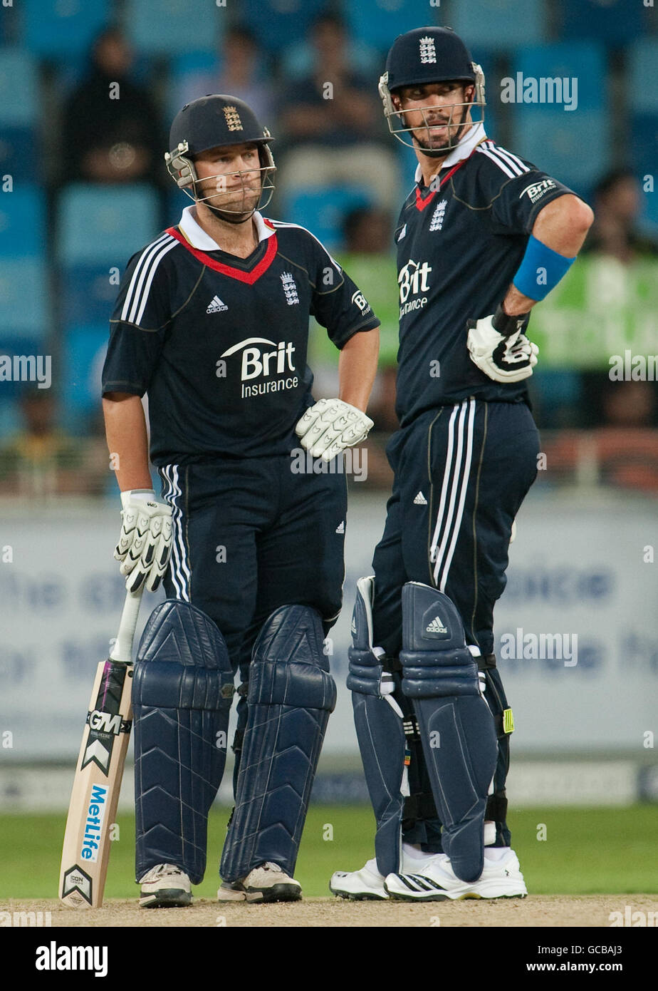 England's Jonathan Trott and Kevin Pietersen during the International Twenty20 Friendly at the Dubai Sports City Stadium, UAE. Stock Photo