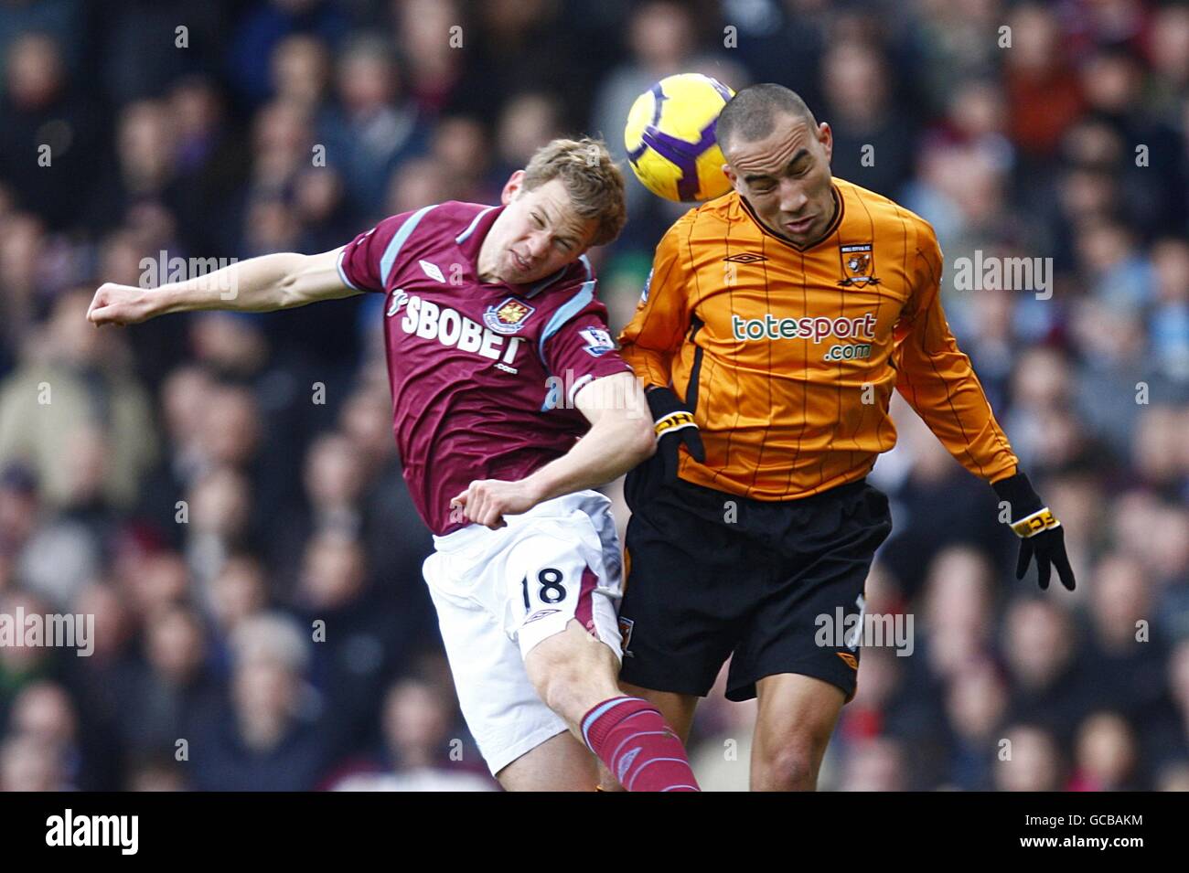 Hull City's Craig Fagan (right) and West Ham United's Jonathan Spector battle for the ball Stock Photo