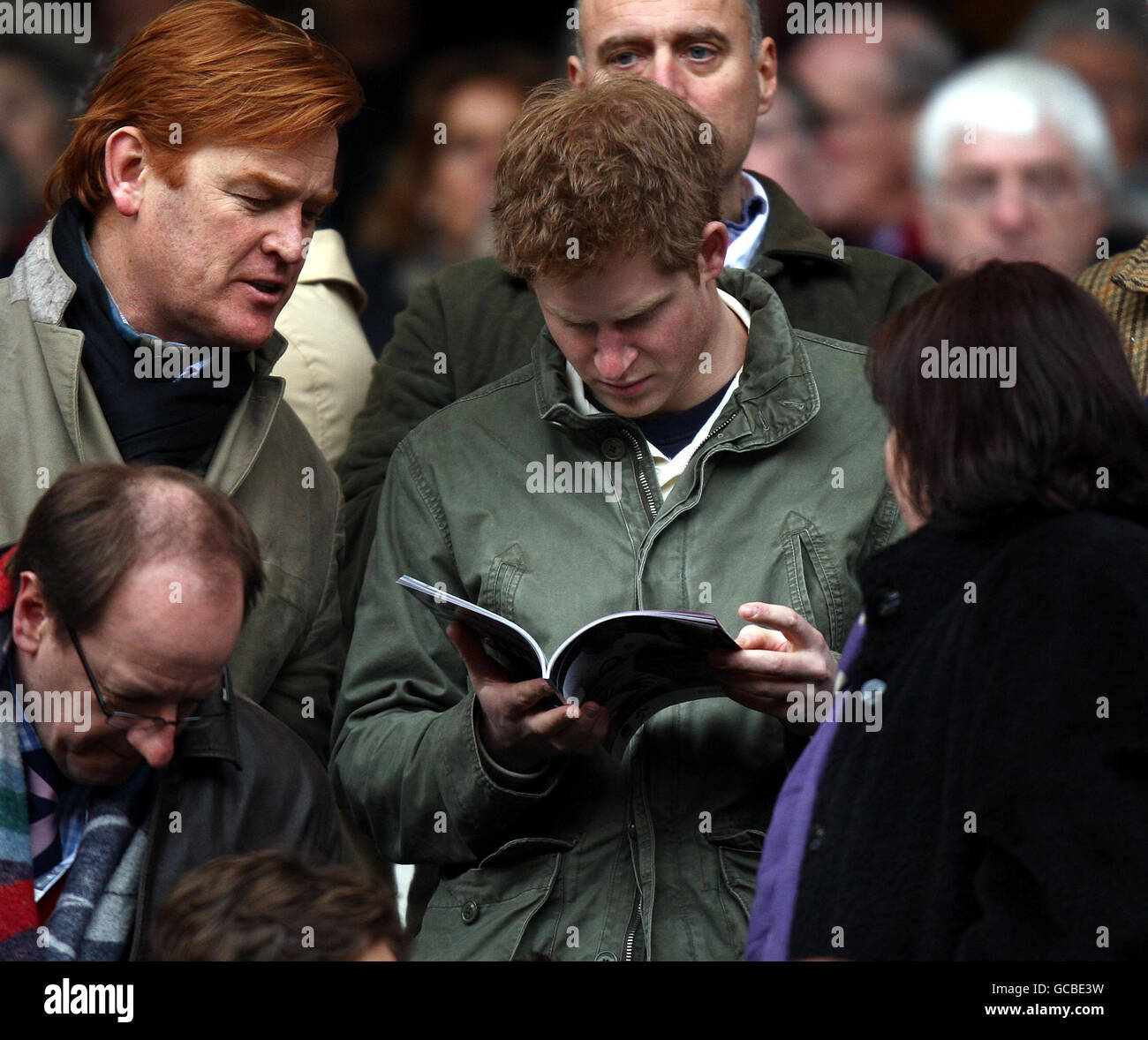 Rugby Union - RBS 6 Nations Championship 2010 - England v Ireland - Twickenham. Prince Harry reads the match day programme during the RBS Six Nations match at Twickenham Stadium, London. Stock Photo
