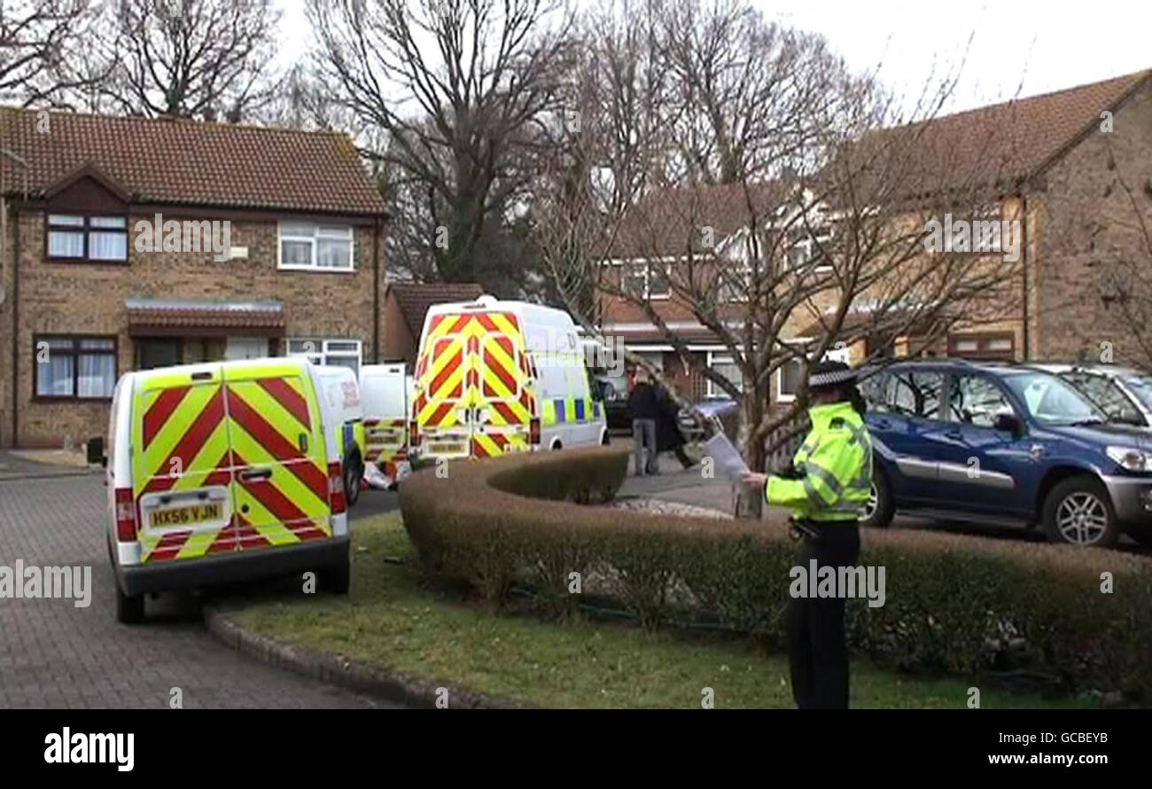 Police officers at the scene where the bodies of a woman and a child were found in a house in Totton, near Southampton today. Stock Photo