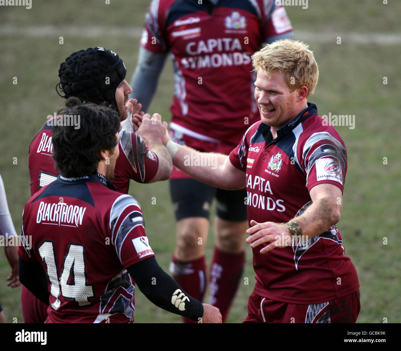 Bristol Rugby's Alex Crockett is congratulated on scoring a try by his teammates Stock Photo
