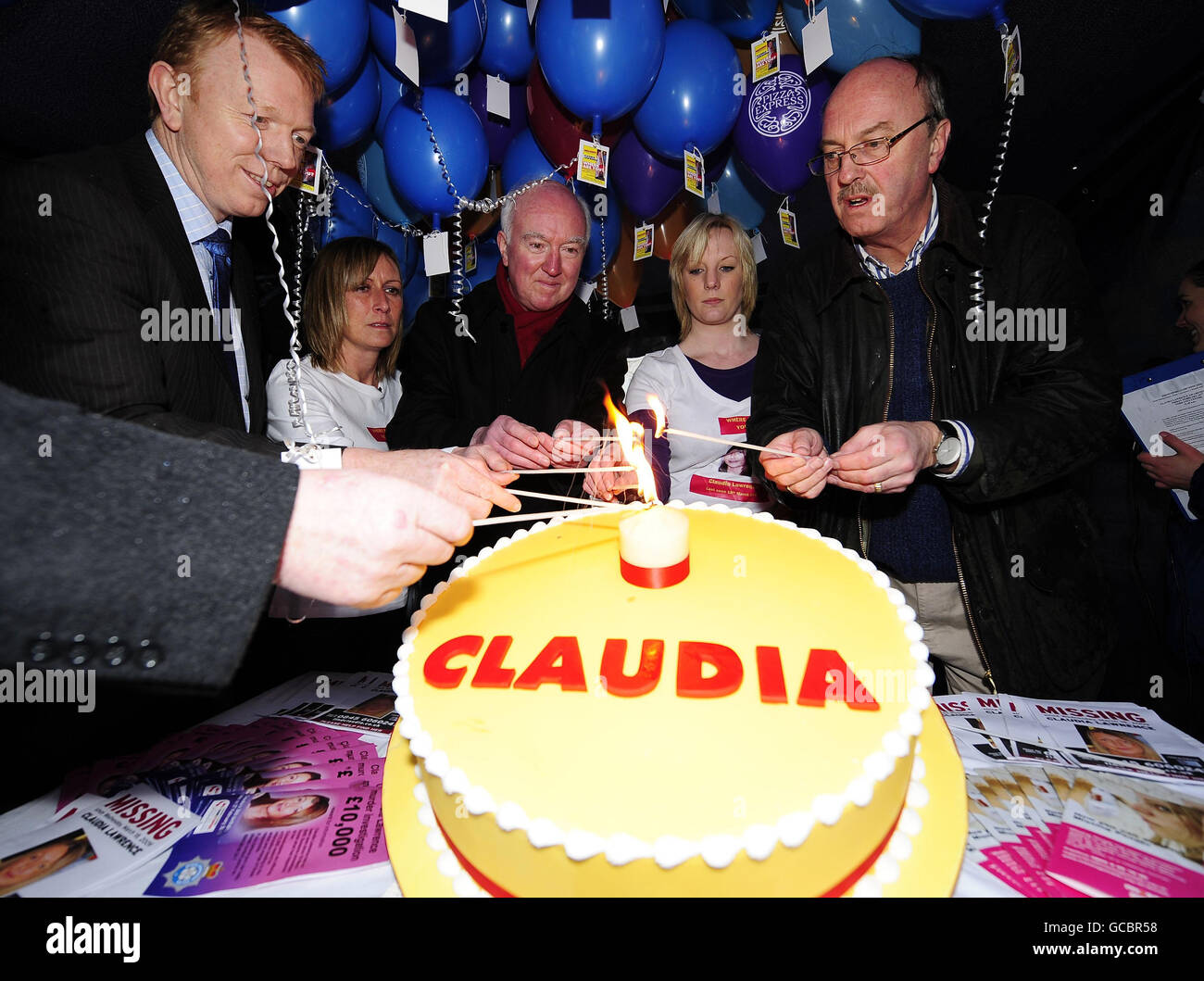 (left to right) Det. Supt. Ray Galloway, Suzy Cooper, Peter Lawrence, Jen King and Martin Dales. The father of missing York chef Claudia Lawrence lights a candle on her birthday cake in York today, on the eve of her 36th birthday. He is joined by her friends, the Police Officer in charge of the investigation, and supporters of the Claudia Lawrence Awareness Day. Stock Photo