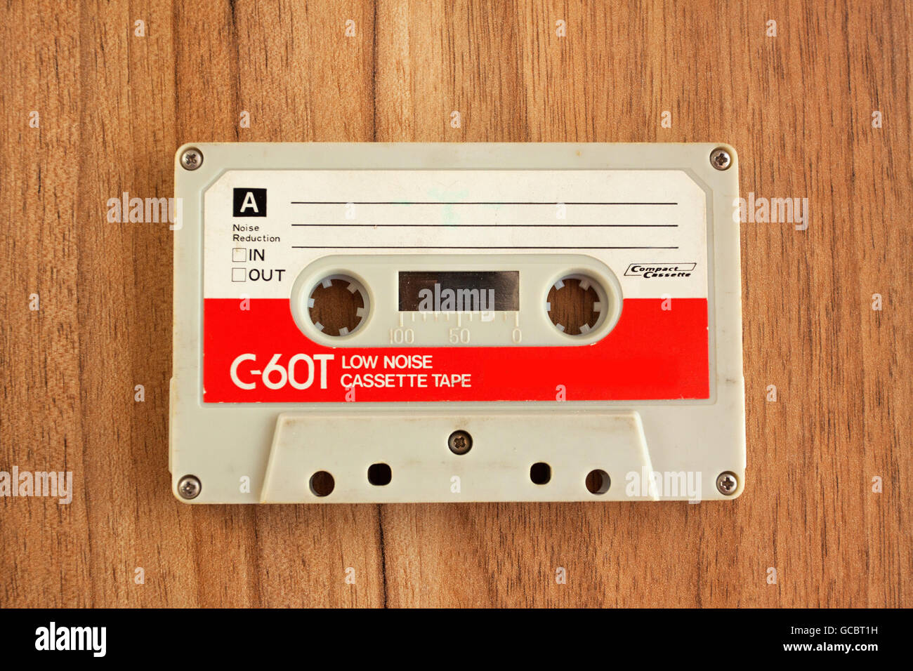 Vintage Cassette tape on wooden background, old technique. Stock Photo