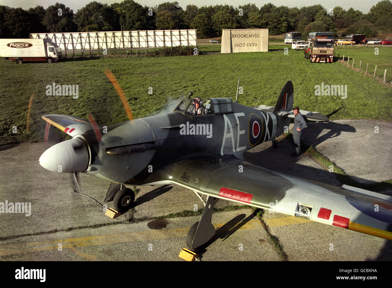 A rebuilt Hawker Hurricane fighter plane starting up its engine for the first time at Brooklands on the 60th anniversary of the first Hurricane flight at Brooklands on 6th November 1935. At the controls is former wartime pilot and Hawker test pilot, Bill Bedford. Stock Photo