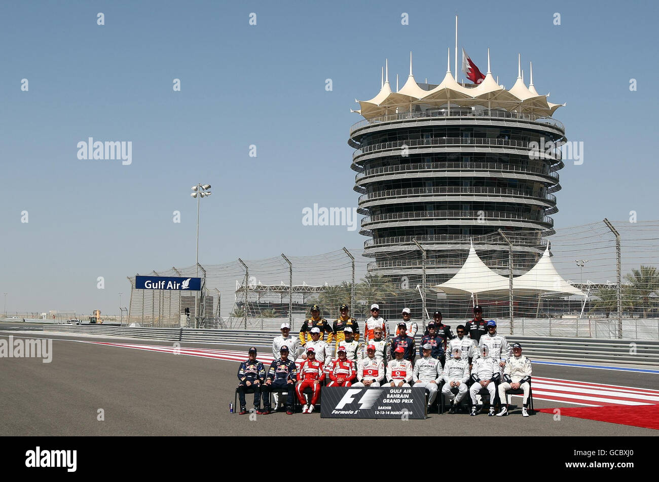 The drivers pose for the annual start of season team group picture prior to during the Gulf Air Bahrain Grand Prix at the Bahrain International Circuit in Sakhir, Bahrain. Stock Photo