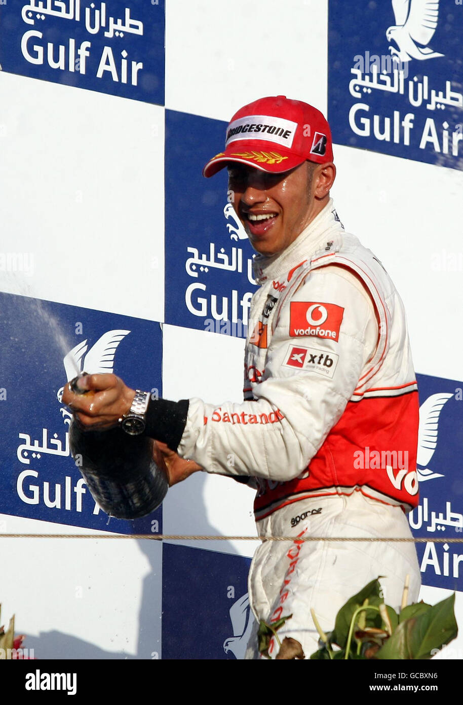 McLaren's Lewis Hamilton celebrates his third place during the Gulf Air Bahrain Grand Prix at the Bahrain International Circuit in Sakhir, Bahrain. Stock Photo