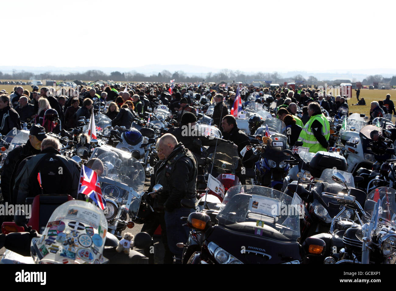 Bikers prepare to take part in a mass motorcycle ride in aid of the charity Afghan Heroes, they set off from Hullavington Airfield and passed through Wootton Bassett, in Wiltshire, to honour troops killed in Afghanistan. Stock Photo