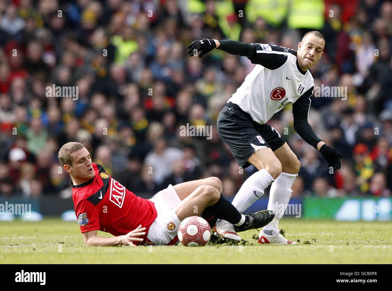 Fulham's Bobby Zamora (right) and Manchester United's Nemanja Vidic battle for the ball Stock Photo