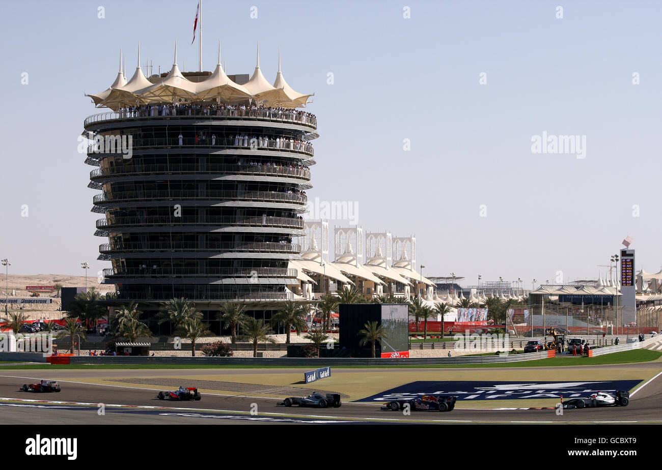 Drivers make their way through the first corner during the Gulf Air Bahrain Grand Prix at the Bahrain International Circuit in Sakhir, Bahrain. Stock Photo