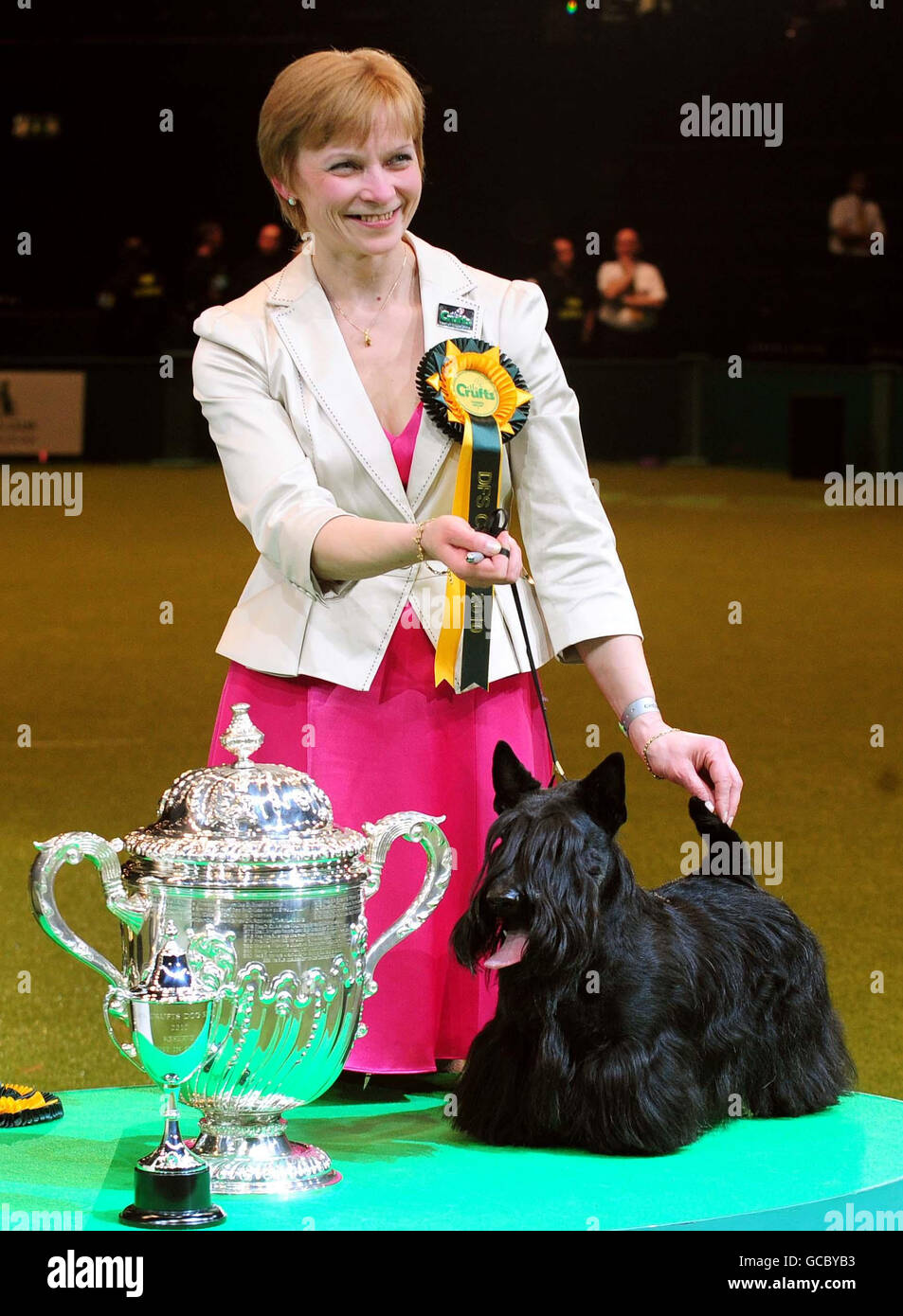 Terrier named Rico from Russia with owner Valentina Popova who came second in the Best In Show at Crufts 2010, at the NEC in Birmingham. Stock Photo