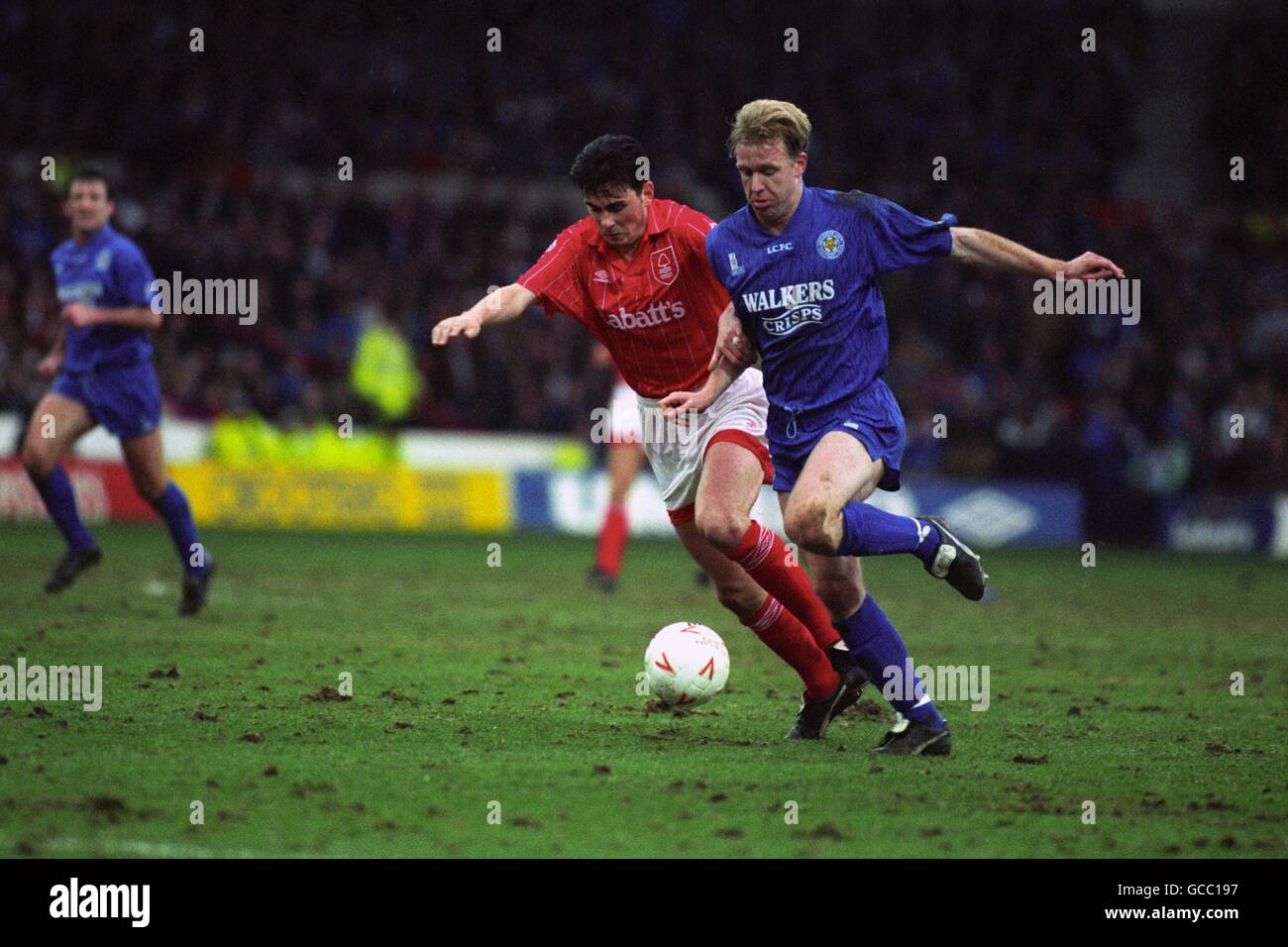 Nottingham Forest's Steve Chettle (l) and Leicester City's David Oldfield (r) battle for the ball. Stock Photo