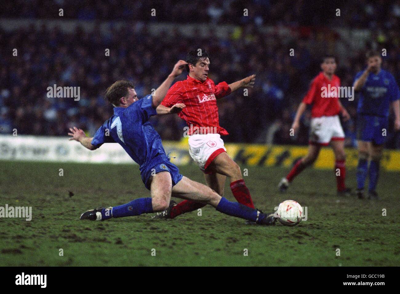 Leicester City's David Oldfield slide tackles Nottingham Forest's Dave Phillips. Stock Photo