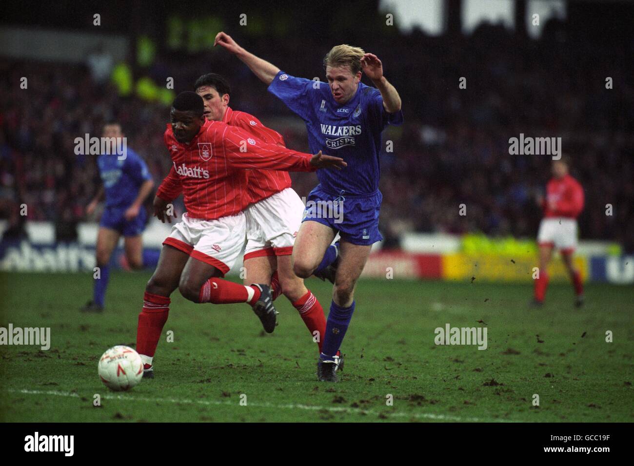 Nottingham Forest's Des Lyttle (l) holds off Leicester City's David Oldfield, watched by Nottingham Forest's Steve Chettle. Stock Photo