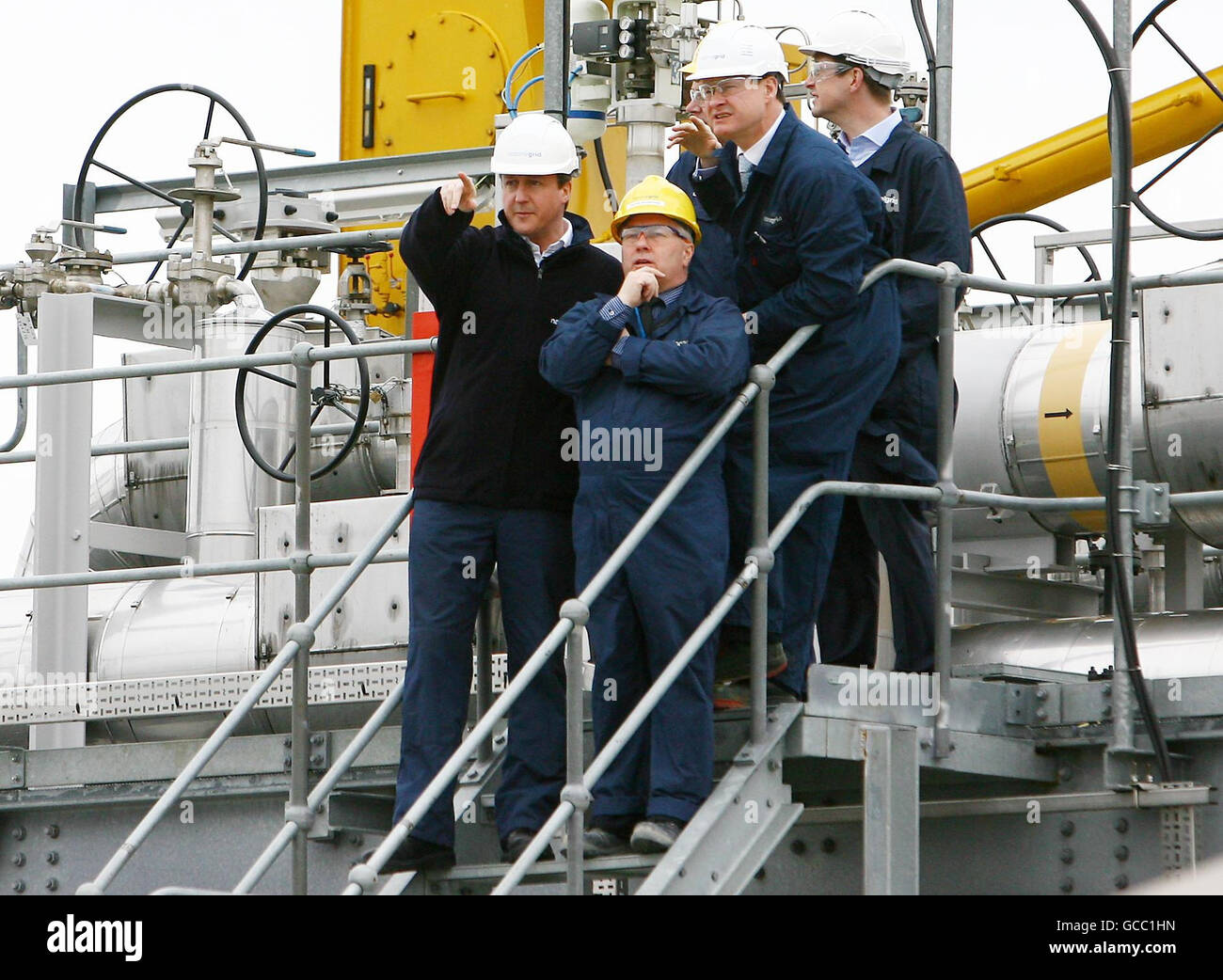 Conservative Party Leader David Cameron (left) is shown around the National Grid Grain LNG site in Grain, Kent, by Director of National Grid LNG, Peter Boreham (centre front) and Steve Holliday (right) C.E.O of National Grid as the Conservative Party launch their Energy Security Green Paper. Stock Photo