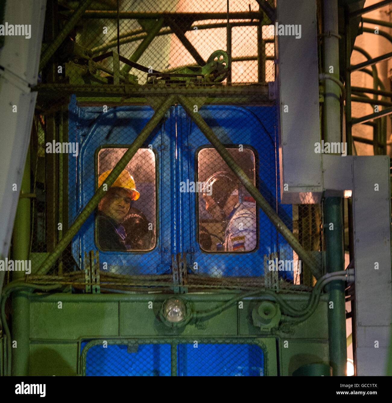 International Space Station Expedition 48 crew members ride the launch pad elevator to the Soyuz MS-01 spacecraft in preparation for launch July 7, 2016 at the Baikonur Cosmodrome in Kazakhstan. Crew members American astronaut Kate Rubins, Russian cosmonaut Anatoly Ivanishin and Japanese astronaut Takuya Onishi departed on four-month mission. Stock Photo