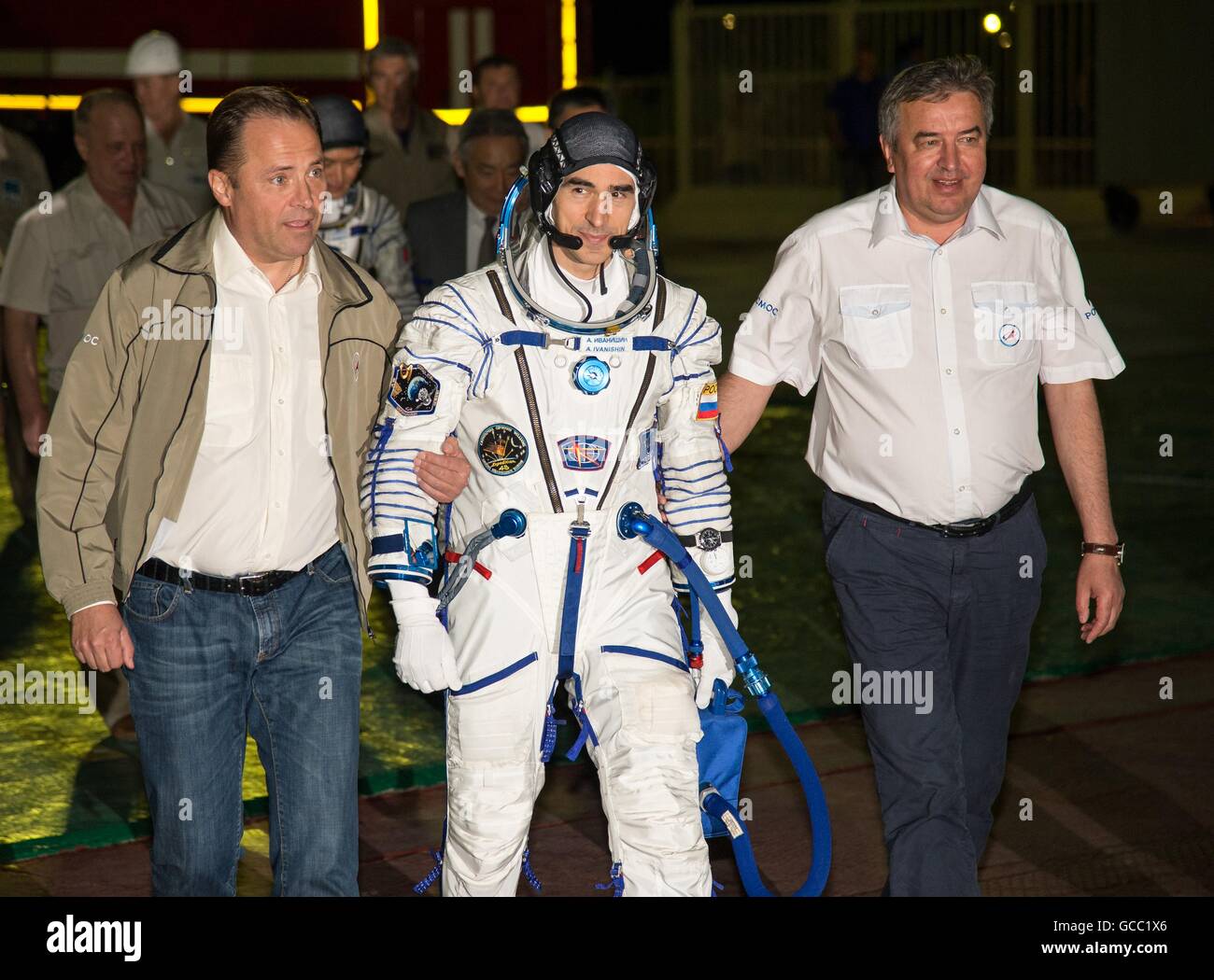 Director General of Roscosmos Igor Komarov, left, and First Deputy Director General Alexander Ivanov walk with Russian cosmonaut Anatoly Ivanishin to the launch pad in preparation for launch July 7, 2016 at the Baikonur Cosmodrome in Kazakhstan. Ivanishin joins crew members American astronaut Kate Rubins and Japanese astronaut Takuya Onishi on four-month mission. Stock Photo