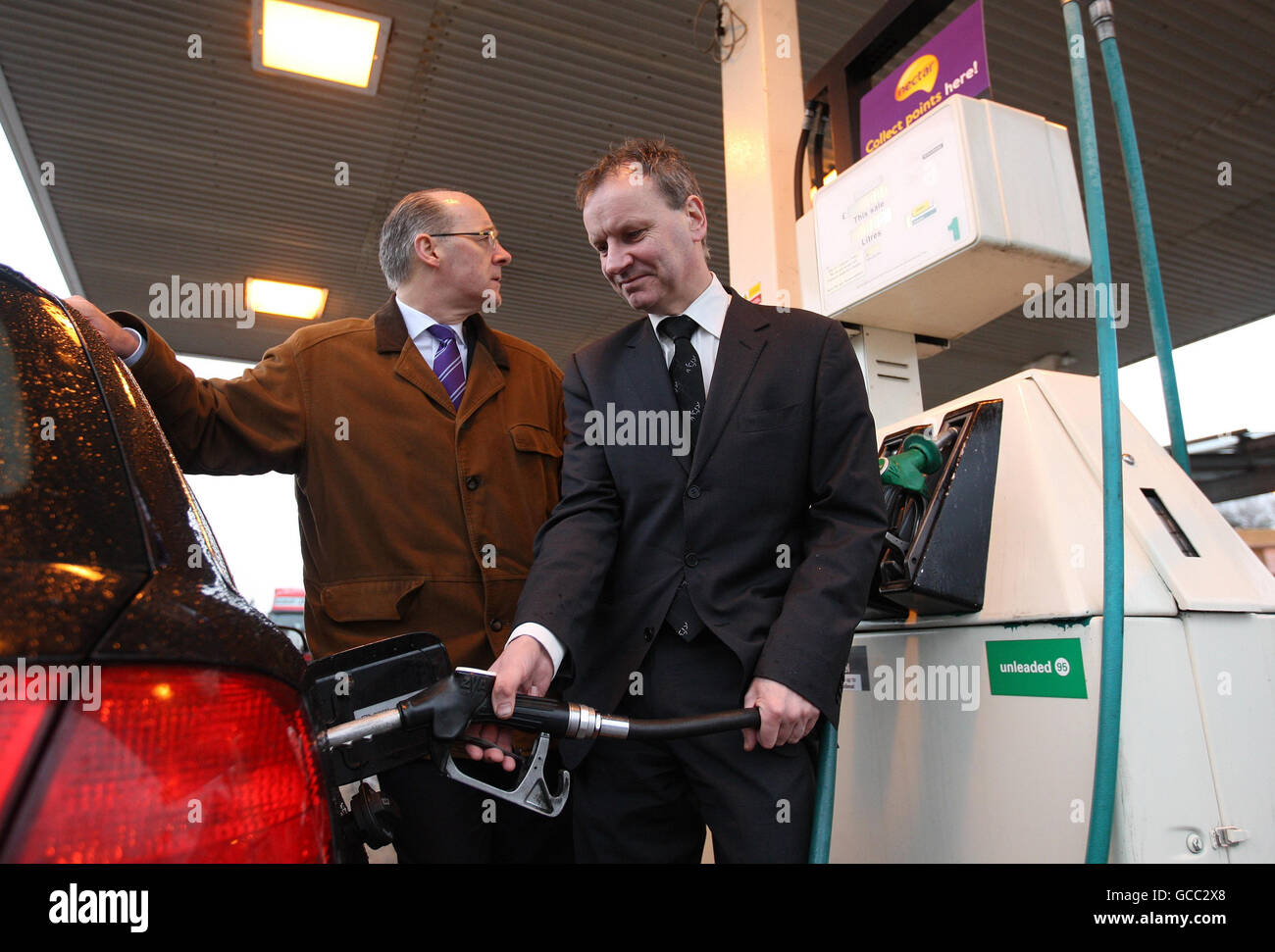 Scottish National Party MSP John Swinney and Pete Wishart MP (right) fill up a car with Diesel at the Ballinluig Motorgrill on the A9 as they launch the SNP 'fair fuel' campaign. Stock Photo