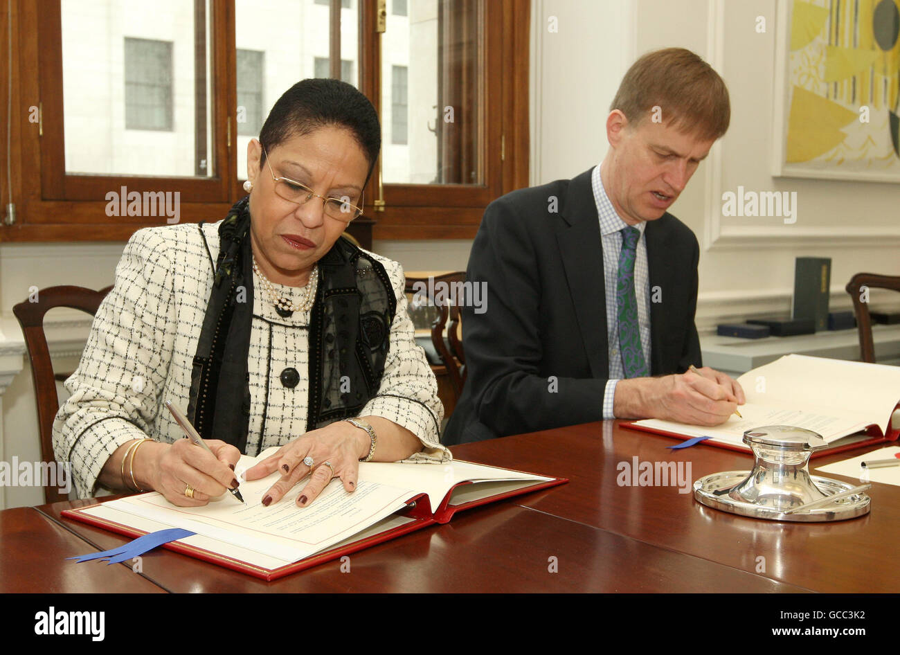 Financial Secretary to the Treasury Stephen Timms signs a tax information exchange agreement with High Commissioner for Belize Kamela Palma, at HM Revenue and Customs, Westminster, London. Stock Photo