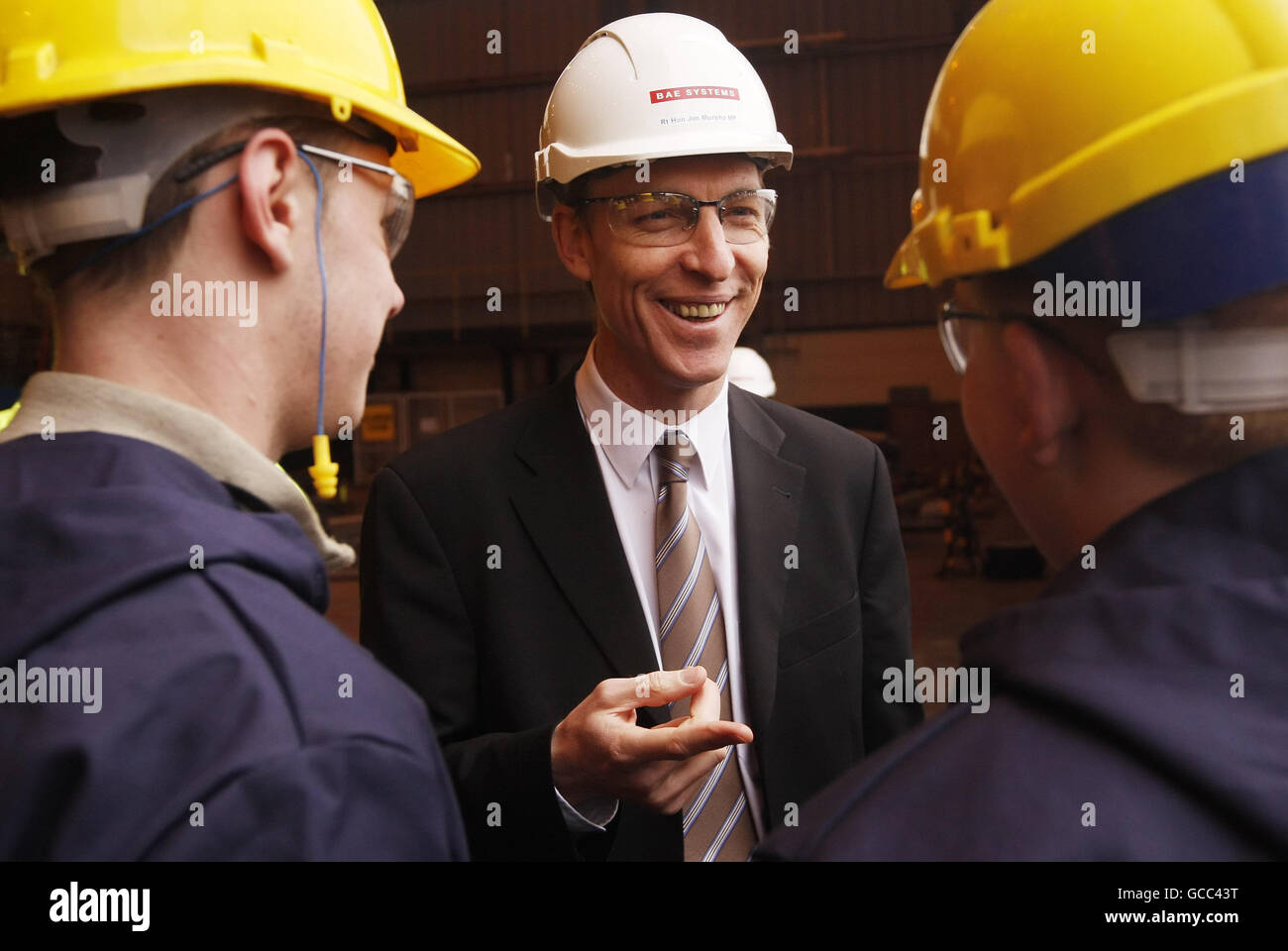 Secretary of State for Scotland Jim Murphy with workers at the Govan Ship Yard in Glasgow during a visit to announce a new contract to develop the next generation of warships. Stock Photo