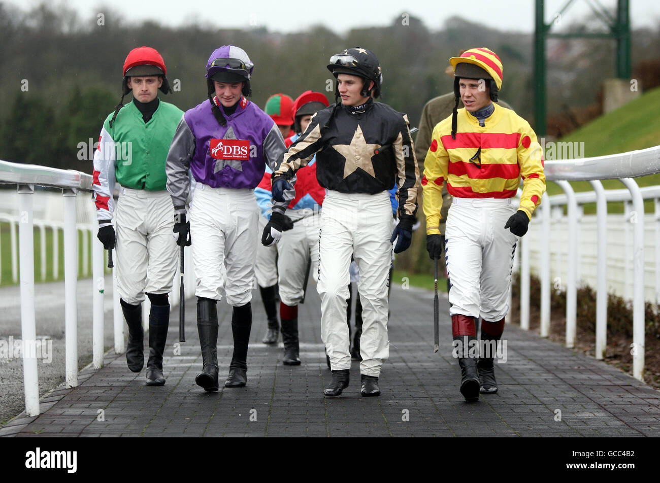 Jockeys (left to right) Michael Murphy, Richie McLernon, Jamie Moore and Richard Johnson make their way out for the Morgan Peterson Supports Paul's Place Handicap Steeple Chase at Chepstow Racecourse. Stock Photo