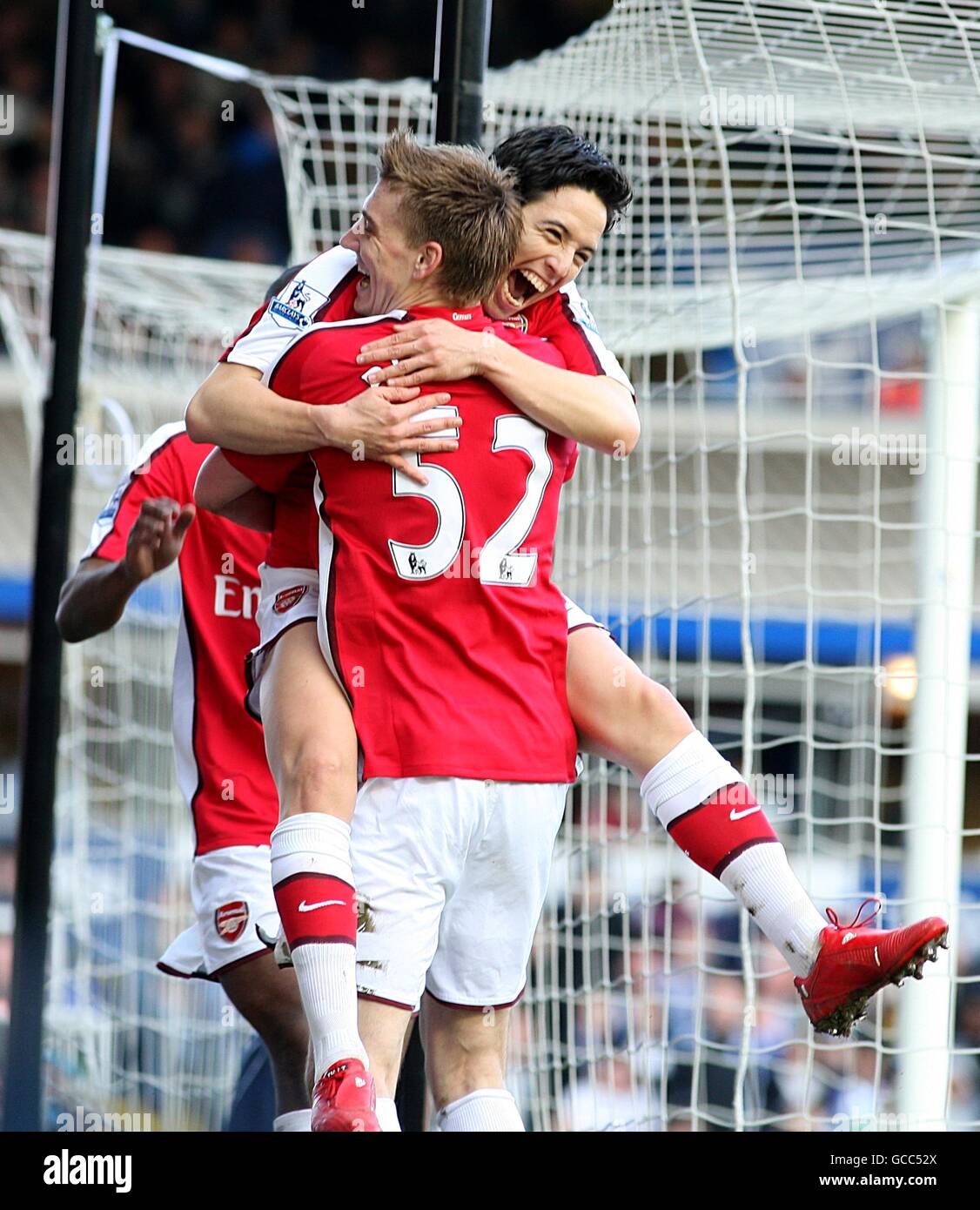 Arsenal's Samir Nasri (top) celebrates with team mate Nicklas Bendtner after scoring his side's first goal of the game Stock Photo