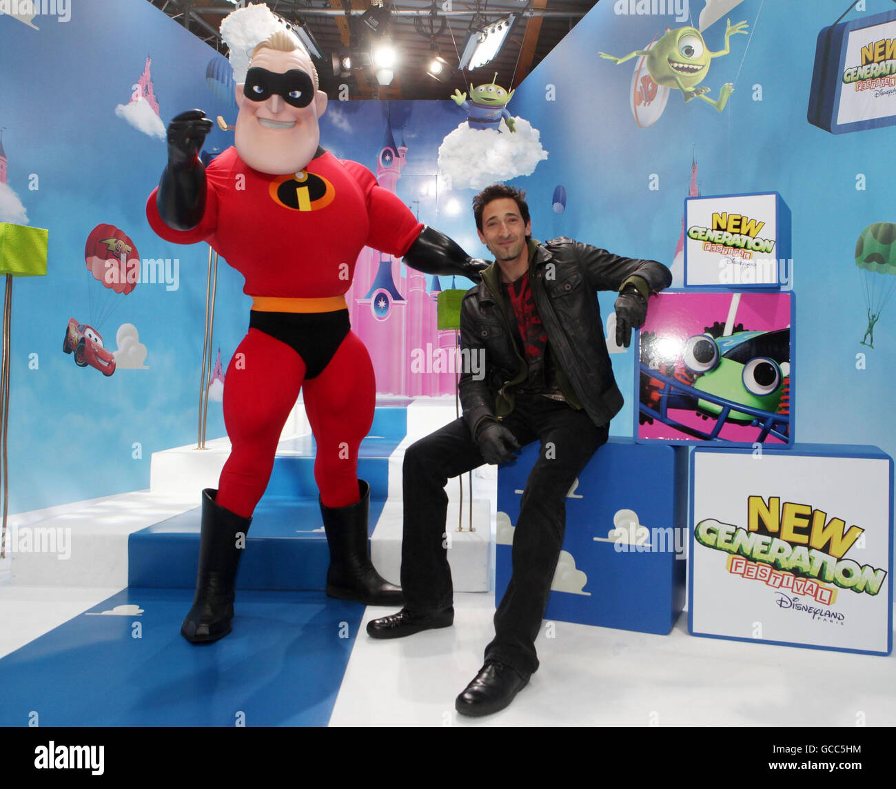 Adrien Brody (right) with a person dressed as the Disney character Mr Incredible at the New Generation Festival launch event at Disneyland Paris. Stock Photo