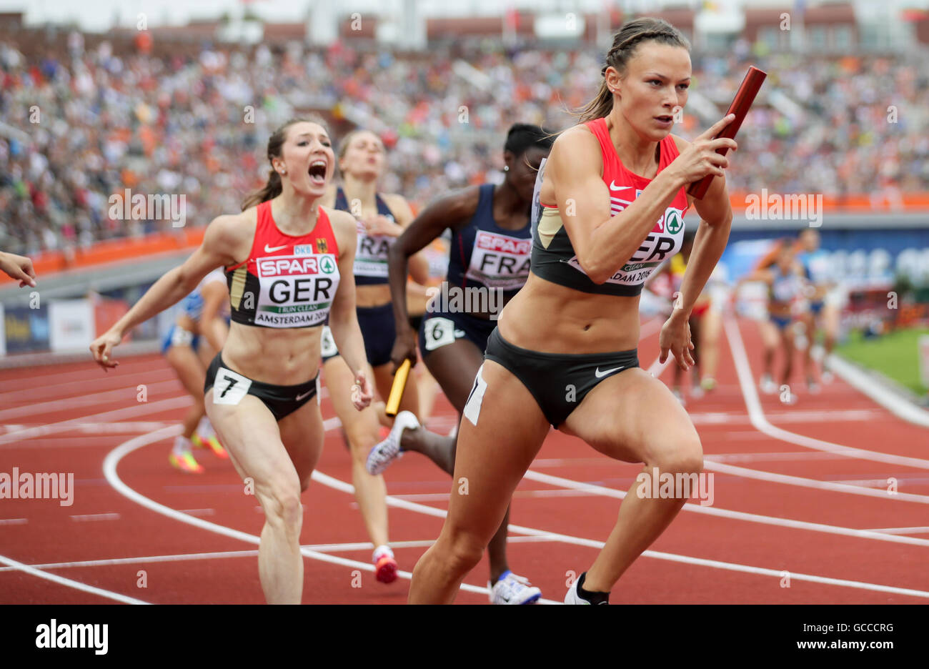 Amsterdam, The Netherlands. 9th July, 2016. German 4 x 400 relay with Laura Müller (L) and Friederike Möhlenkamp at the first change over at the European Athletics Championships at the Olympic Stadium in Amsterdam, The Netherlands, 9 July 2016. Photo: Michael Kappeler/dpa/Alamy Live News Stock Photo