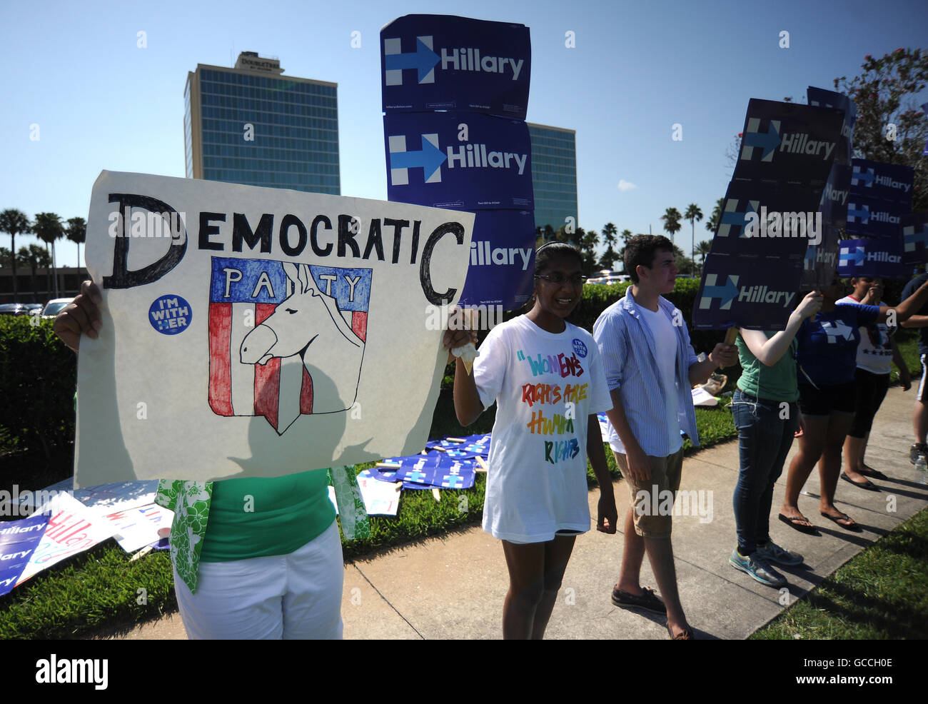 Orlando, Florida, USA. 9th July, 2016. Supporters of presumptive Democratic presidential nominee Hillary Clinton hold signs outside the 2016 Democratic National Convention Platform Committee Meeting at the Doubletree by Hilton Hotel in Orlando, Florida on July 9, 2016. Democratic presidential candidate Bernie Sanders failed to get strong language opposing the Trans-Pacific Partnership inserted in the draft Democratic platform at the party meeting. Credit:  Paul Hennessy/Alamy Live News Stock Photo