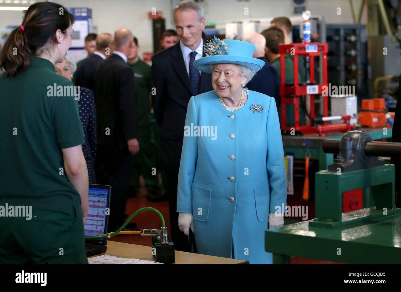 Queen Elizabeth II meets apprentices during a visit to the training school  and workshop at the Michelin tyre factory in Dundee Stock Photo - Alamy