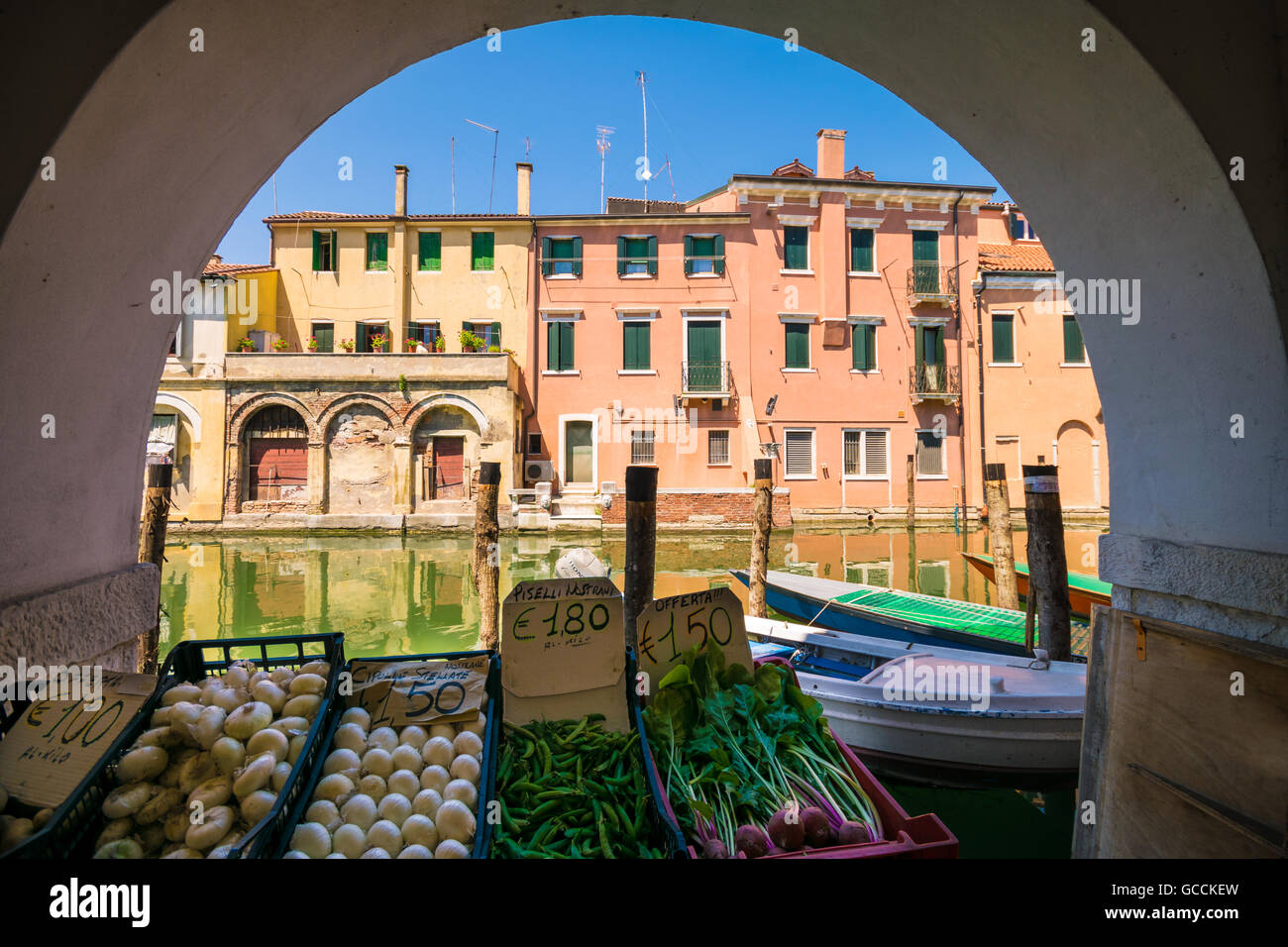 Chioggia glimpse from the arcades along the canals. Stock Photo