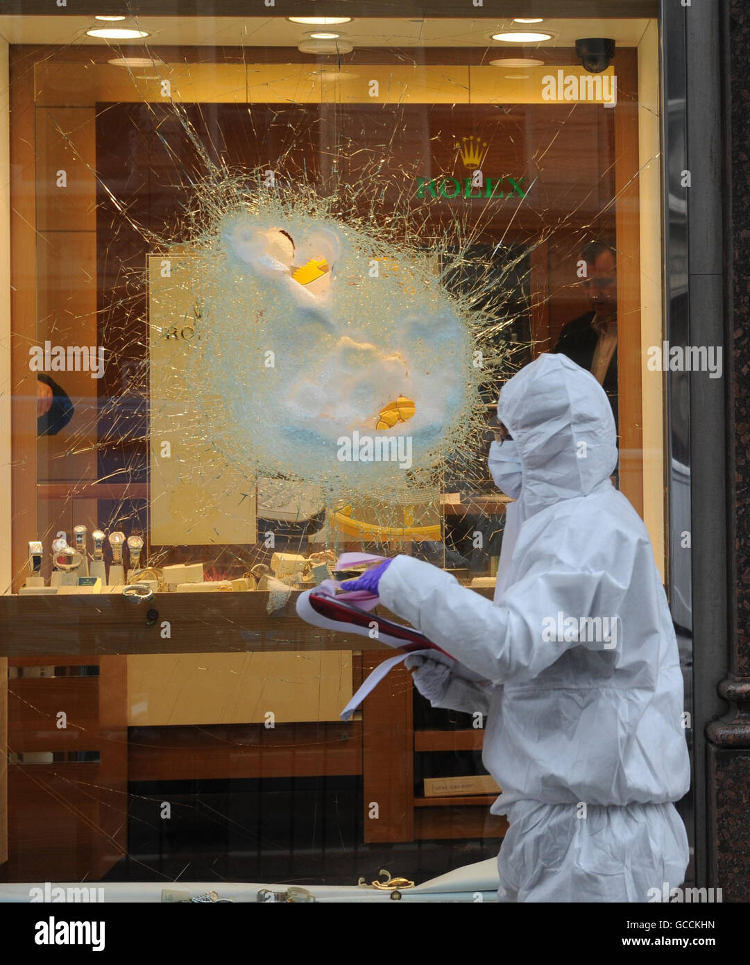 Forensic officers attend the scene of a smash and grab raid at the Jewellers Mappin and Webb on Piccadilly at the junction of Old Bond Street and Piccadilly in London's West End. Stock Photo