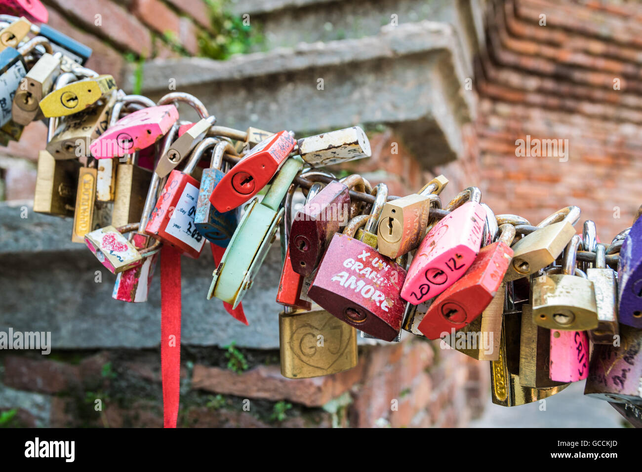 Padlocks left by lovers in Verona as a promise of love. Stock Photo