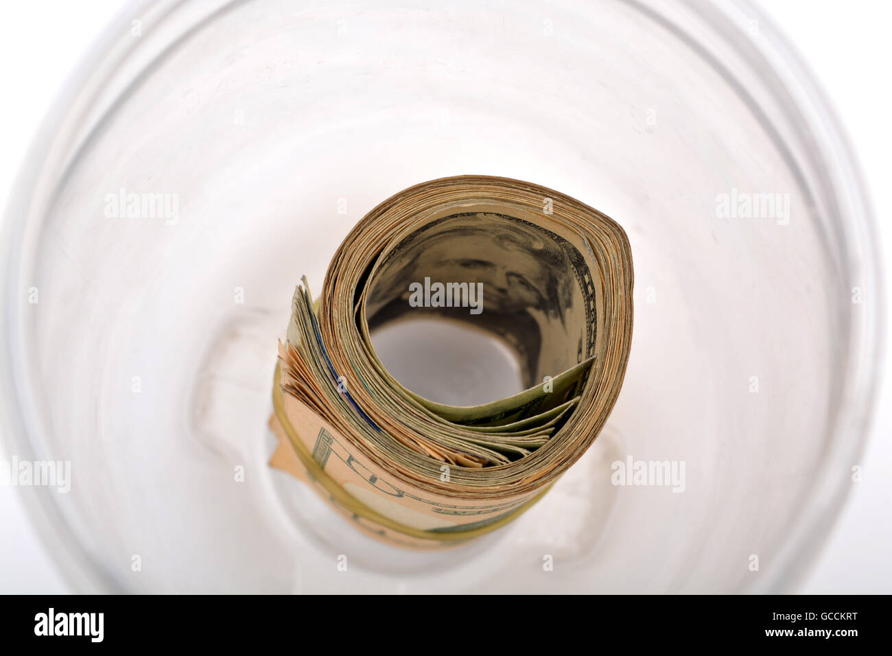Pile of currency notes in jar. Stock Photo