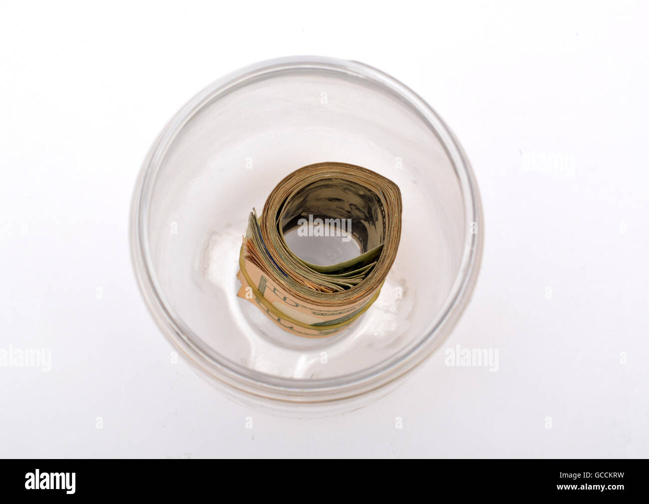 Pile of dollars in a jar top view. Stock Photo