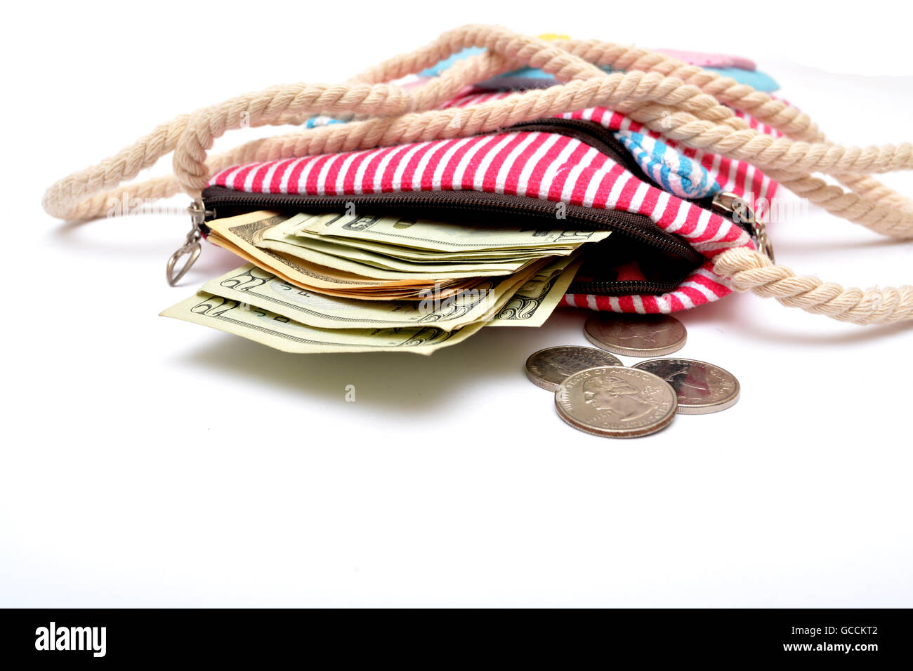 Money coming out of girl hand bag close up. Stock Photo